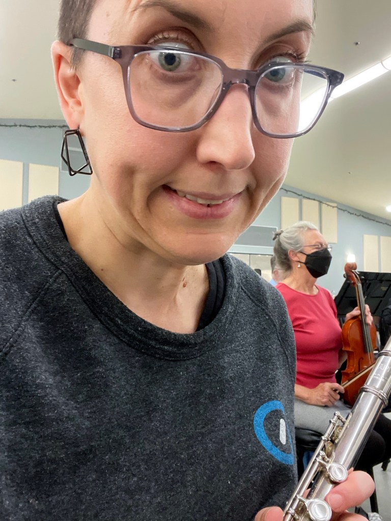 Pulling a face that says nothing if not shitting myself as I hold my flute and glance wild eyed at the camera.